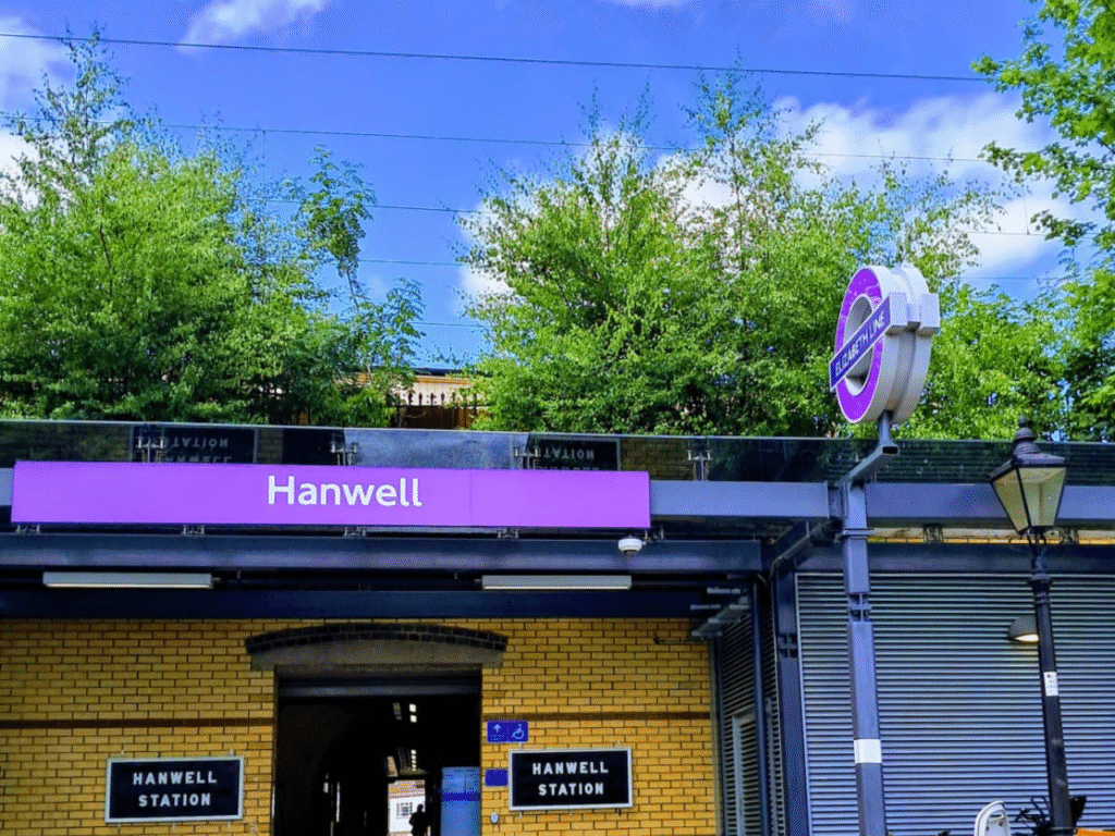 Hanwell locksmith W7 | Hanwell Station yellow bricks and purple board written with white characters