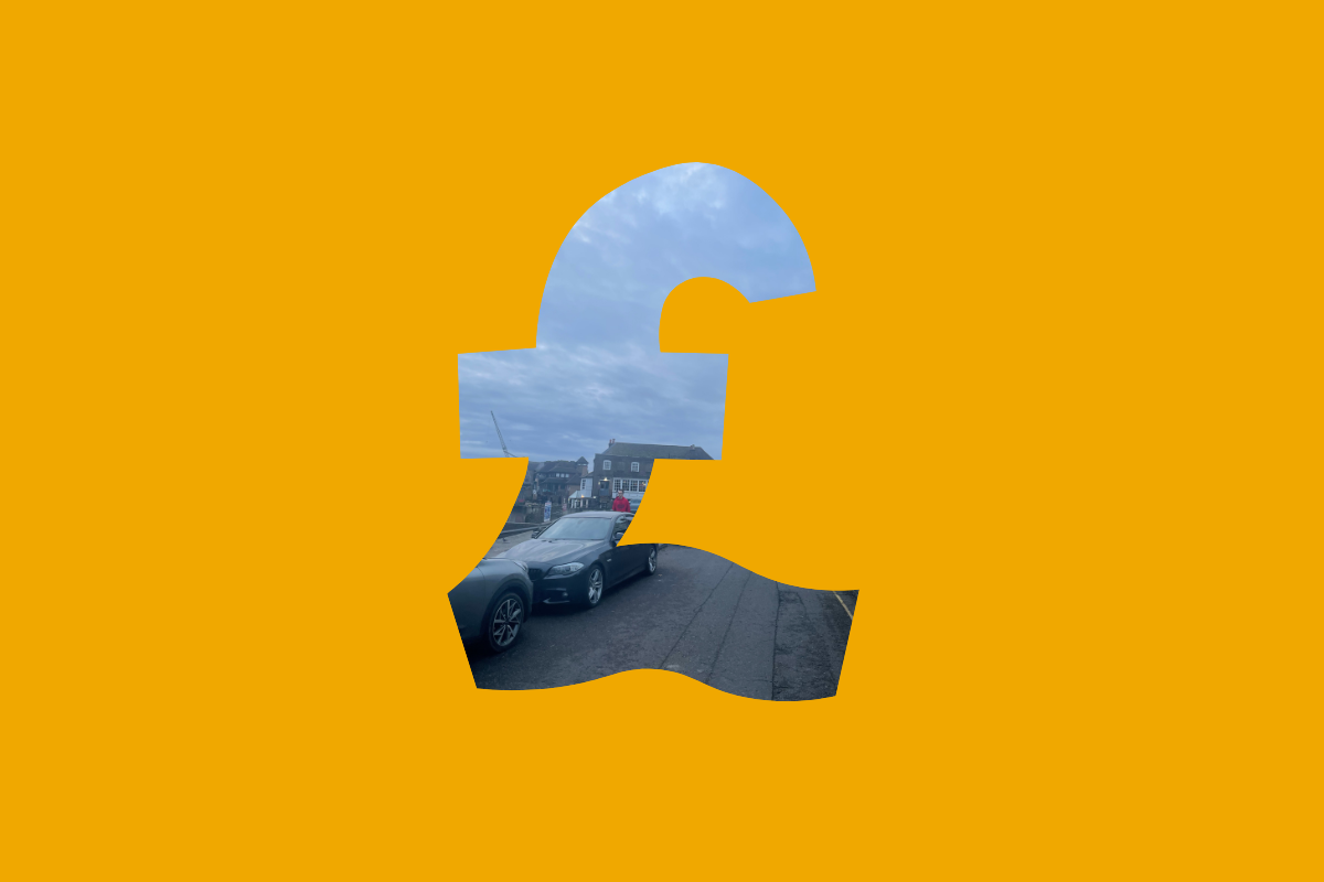 A figuerine man resting a huge key