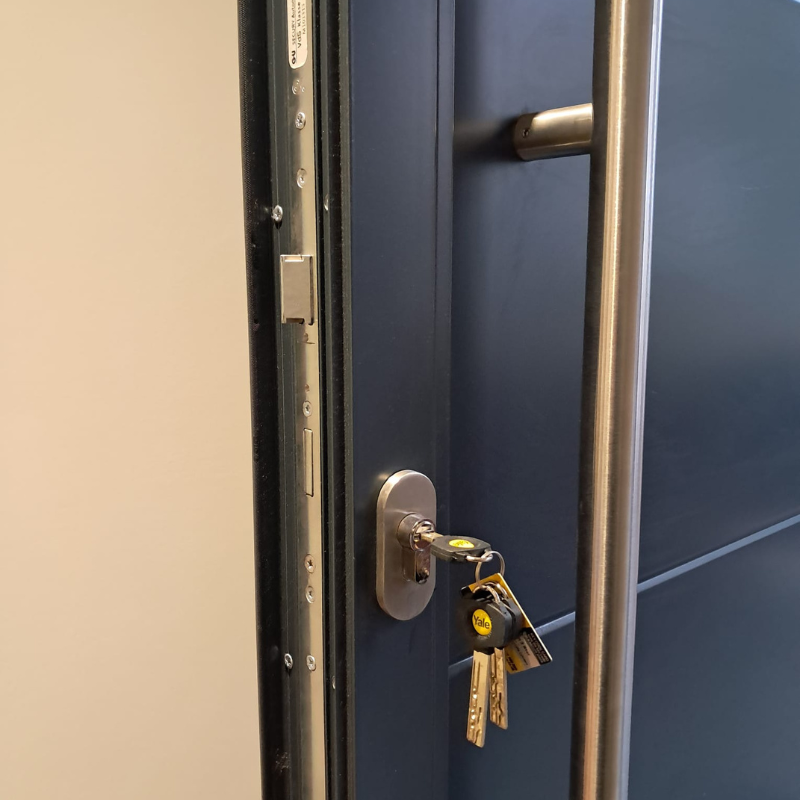 A figuerine man resting a huge key